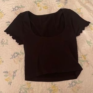 Stretchy stylish black crop top, open a bit in front and closed in the back :)